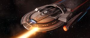 A Reliant-class ship firing one of her main phaser arrays.